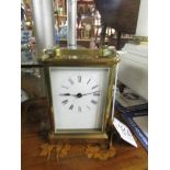 A brass carriage clock.