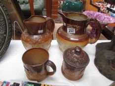 2 stone ware jugs, a tankard and a tobacco jar.