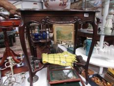 A mahogany occasional table.