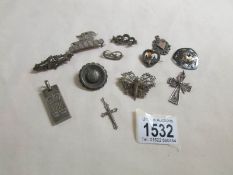 A mixed lot of silver brooches, pendants etc.