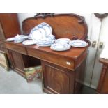 A Victorian mahogany double pedestal sideboard.