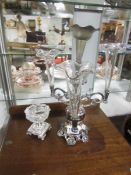 A silver plate and glass epergne and one other item.