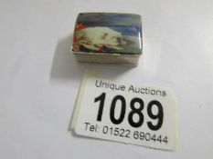 A modern silver and enamel pill box with British bulldog scene.