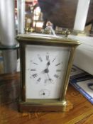 A brass carriage clock.