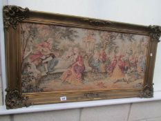 A framed tapestry.