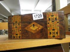 A mahogany inlaid box.