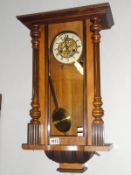 A Victorian mahogany wall clock.