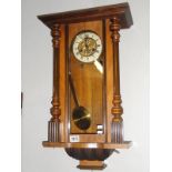 A Victorian mahogany wall clock.