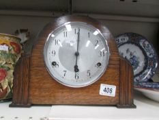 An oak mantel clock.