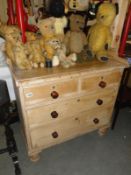 A 2 over 2 pine chest of drawers.