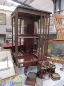 A mahogany revolving book case.