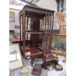 A mahogany revolving book case.