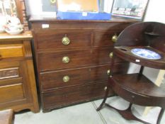 A 2 over 3 mahogany chest of drawers (missing one handle).