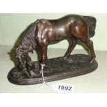 A spelter horse with dog.