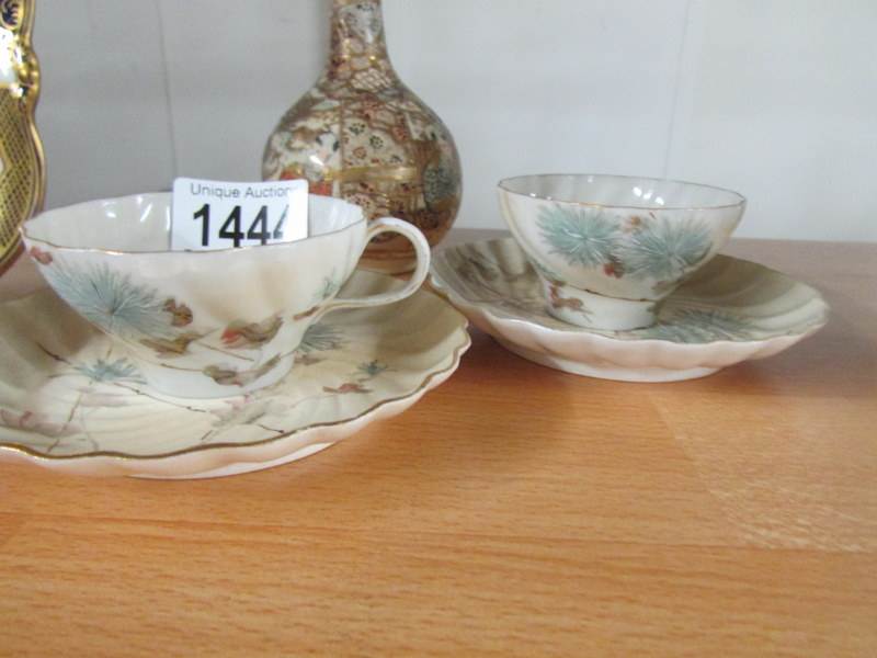 A Satsuma 'bottle' vase and a pair of porcelain cups and saucers. - Image 5 of 5