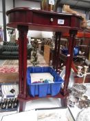 A modern mahogany occasional table.