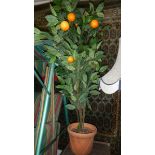 A plastic orange tree,