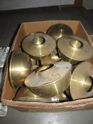 A box of brass oil lamp fonts.