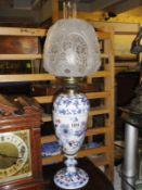 A Victorian ceramic oil lamp base with not matching font.