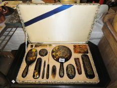 A fine early 20th century tortoise shell vanity set in case consisting of 12 pieces 2 of which are