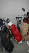 A large quantity of golf bags, trolley's and clubs.