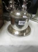 A silver plate biscuit barrel.