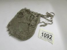 A silver chain mail mesh purse, approximately 3 ounces.