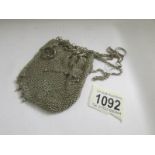 A silver chain mail mesh purse, approximately 3 ounces.