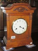 An Edwardian oak cased mantel clock with Westminster chime.