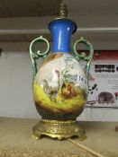 A good hand painted porcelain and ormolu table lamp base (need wiring).