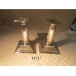 A pair of silver 'Palladian' style candlesticks, London 1893/94, 360 grams.