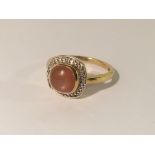 A moonstone dress ring, size P.