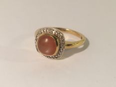 A moonstone dress ring, size P.