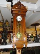 A Gustav Becker regulator wall clock, signed on movement, 4" dial geared down, oak carved case.