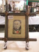 A framed and glazed woven silk of The Rt. Hon. W E Gladstone MP by T Stevens, Coventry.