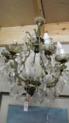 An old 8 lamp chandelier for restoration.