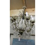 An old 8 lamp chandelier for restoration.