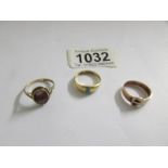 2 9ct gold rings set stone and a 9ct gold 'buckle' ring, sizes L M & O, 9.9 grams.