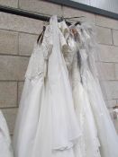 Approximately 12 wedding gowns in various sizes.