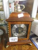 A small bracket style mantel clock, 8 day, fixed key, walnut case.