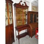 An Edwardian mahogany inlaid cabinet on stand.