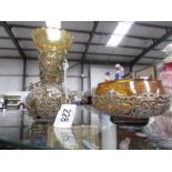 A glass vase and bowl encrusted in white metal.