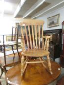 A Windsor rocking chair.