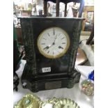 A black marble mantel clock.