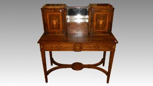 An Edward & Roberts signed rosewood and marquetry desk.