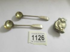 A pair of George III silver mustard spoons and an EPNS child's rattle.