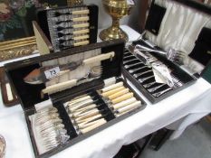 4 cased cutlery sets.