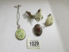 3 silver claw brooches, a silver brooch with picture and a silver pendant on chain.