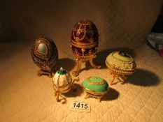 5 decorative egg shaped trinket boxes.