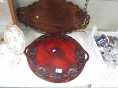 2 carved wood trays.